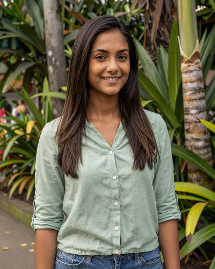 Beautiful Indo-Guyanese woman in Georgetown garden representing authentic Guyanese singles dating