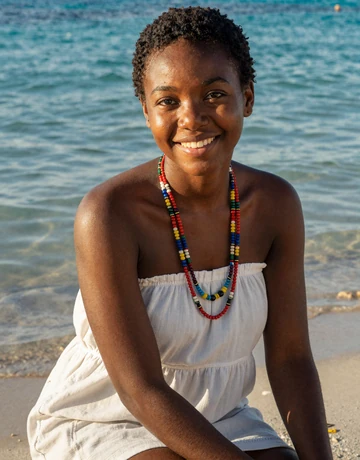 Lovely, 24, young Haitian woman from Jacmel beach in white dress for dating profile